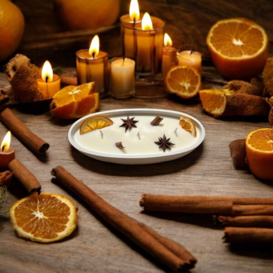 vela canela y naranja